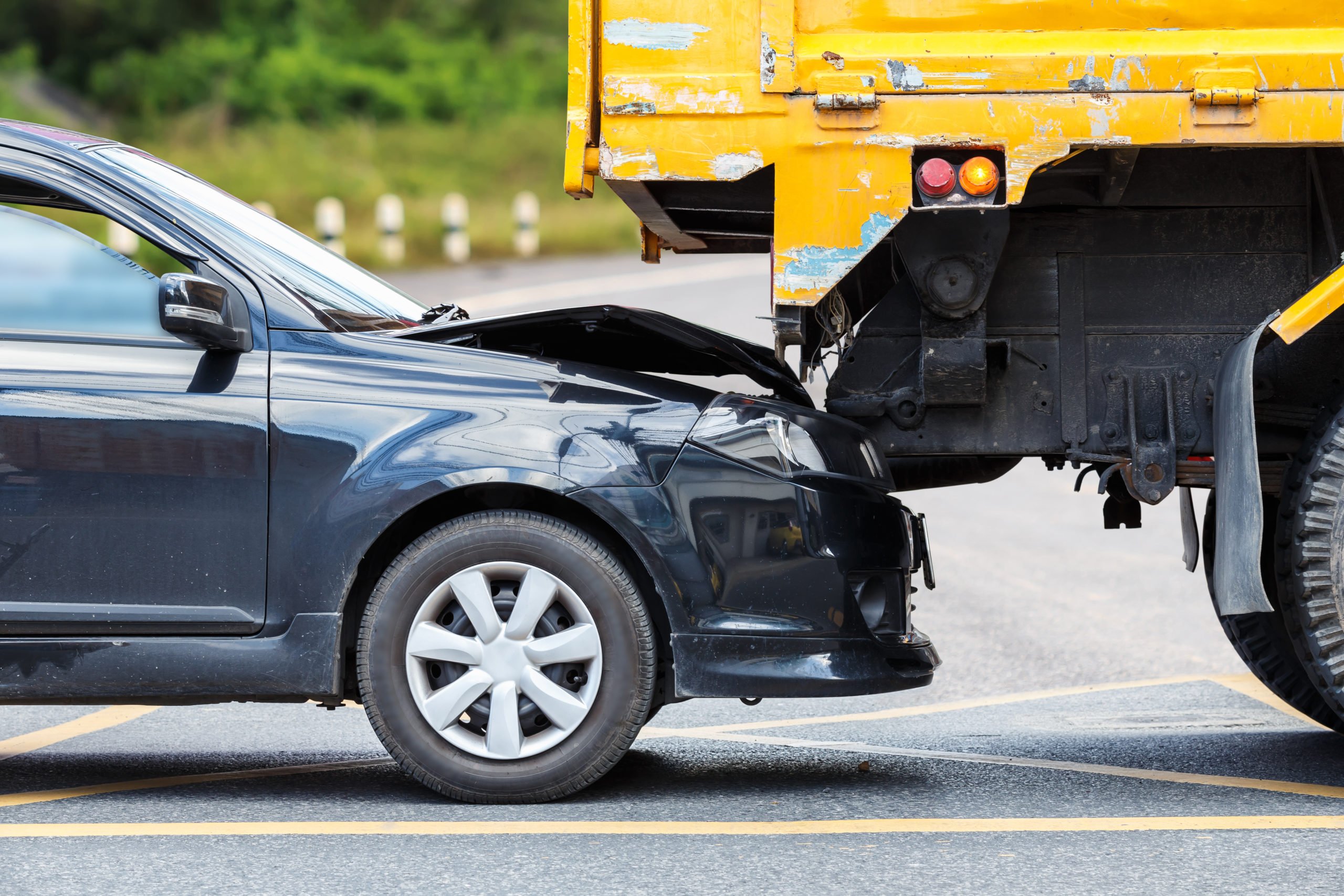 if my car is totaled in a rear-end collision with a commercial truck do i need a car accident attorney or a trucking accident attorney