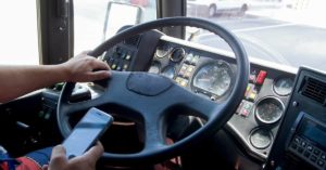 truck driver distracted by a mobile phone