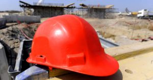 hard hat sitting on wall at a construction site