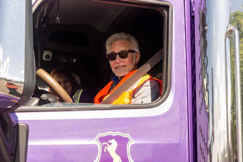 attorney Michael Maggiano behind the wheel of a big rig truck