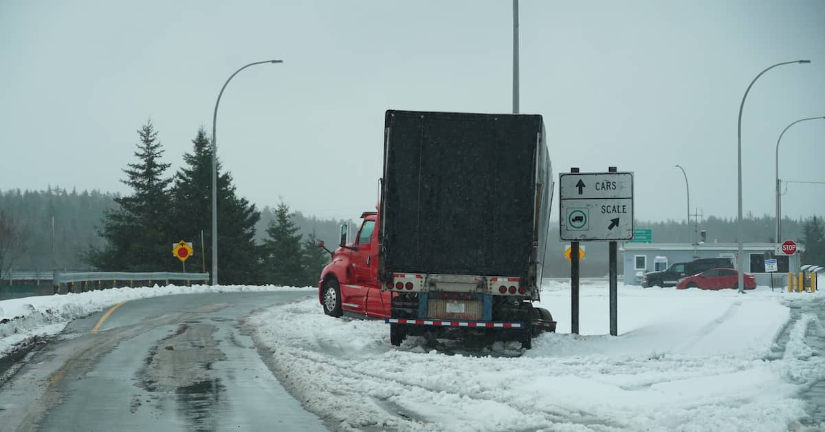 semi-truck stranded on the side of the road after an accident