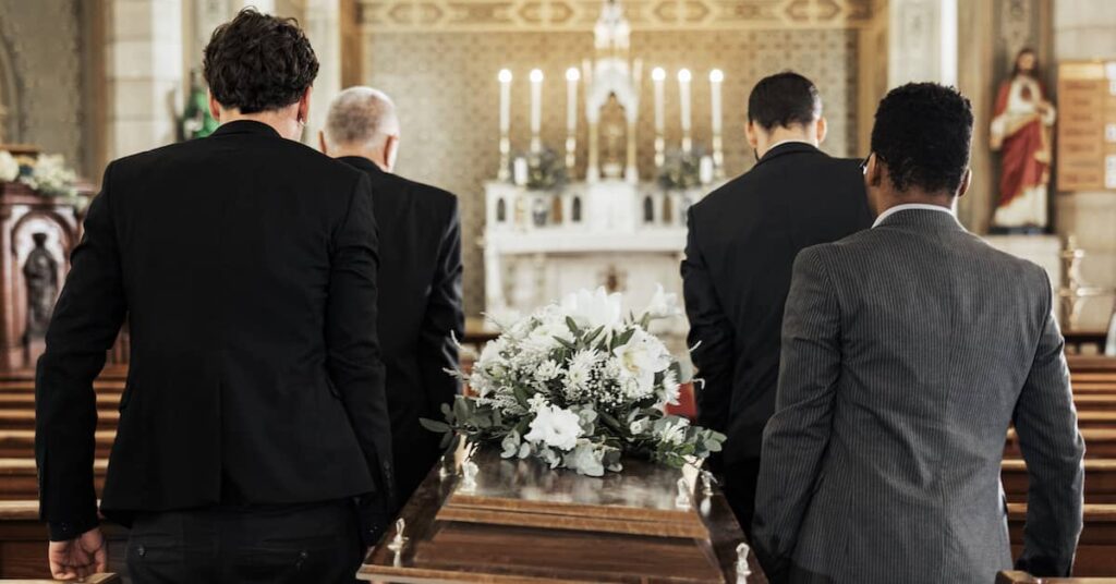 Men carrying casket. | Maggiano, DiGirolamo & Lizzi