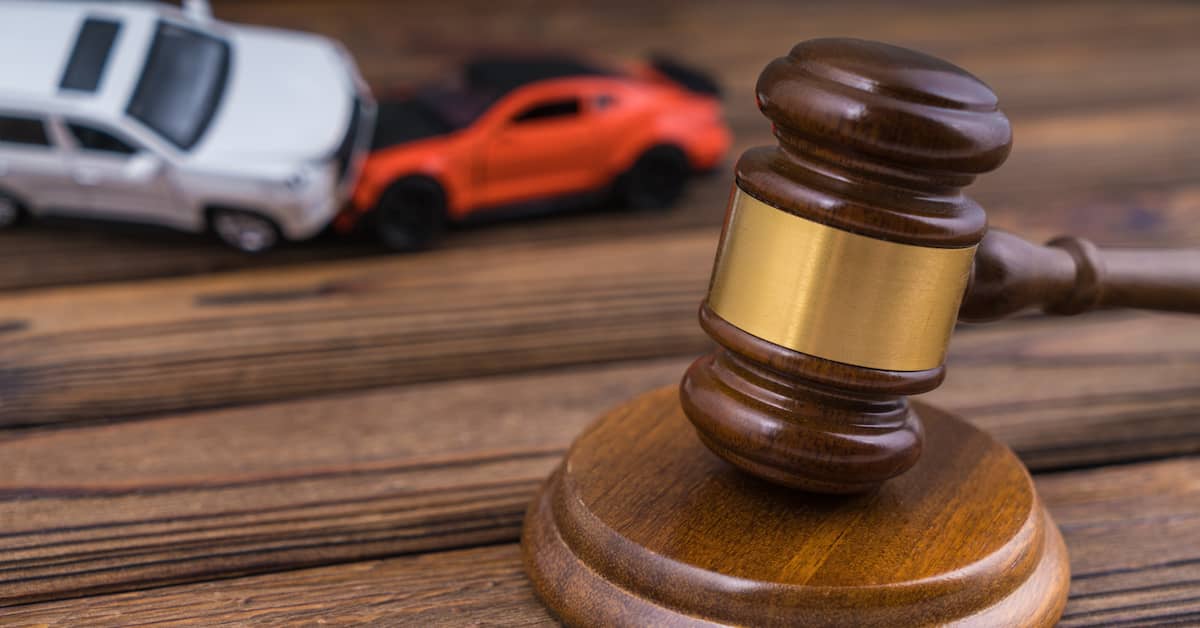 Judge's gavel in front of toy cars in an accident. | Maggiano, DiGirolamo & Lizzi