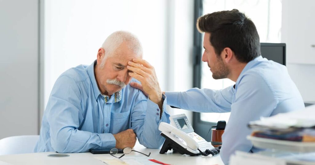 Personal injury attorney with a client. | Maggiano, DiGirolamo & Lizzi staten island personal injury lawyers