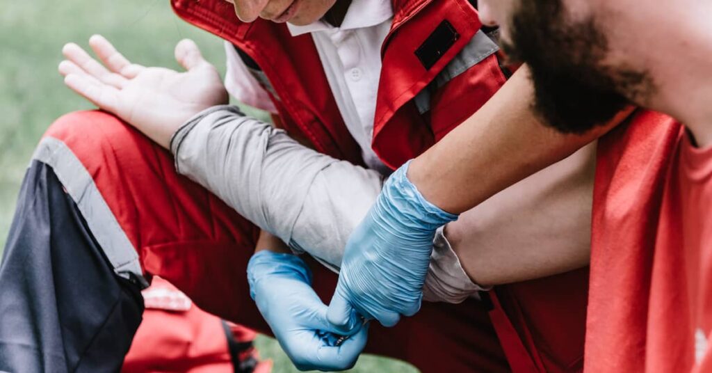 First responder bandages the burned arm of victim. | Maggiano, DiGirolamo & Lizzi