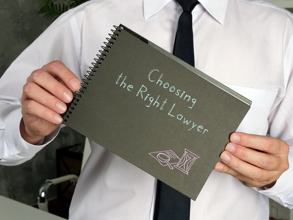 Choosing the Right Lawyer with inscription on the piece of paper.
