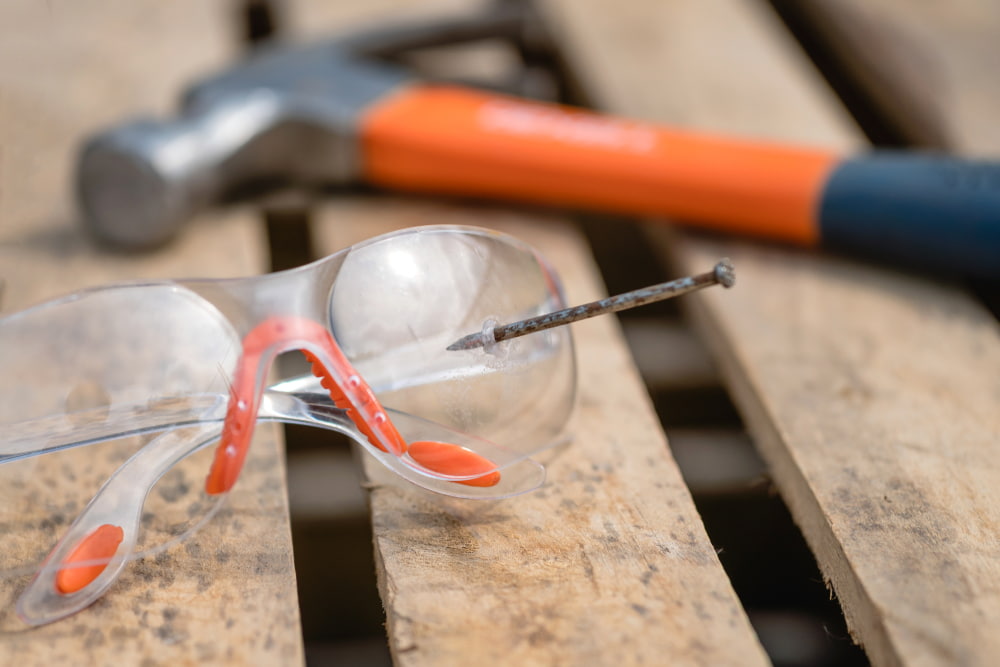 nail through safety glasses